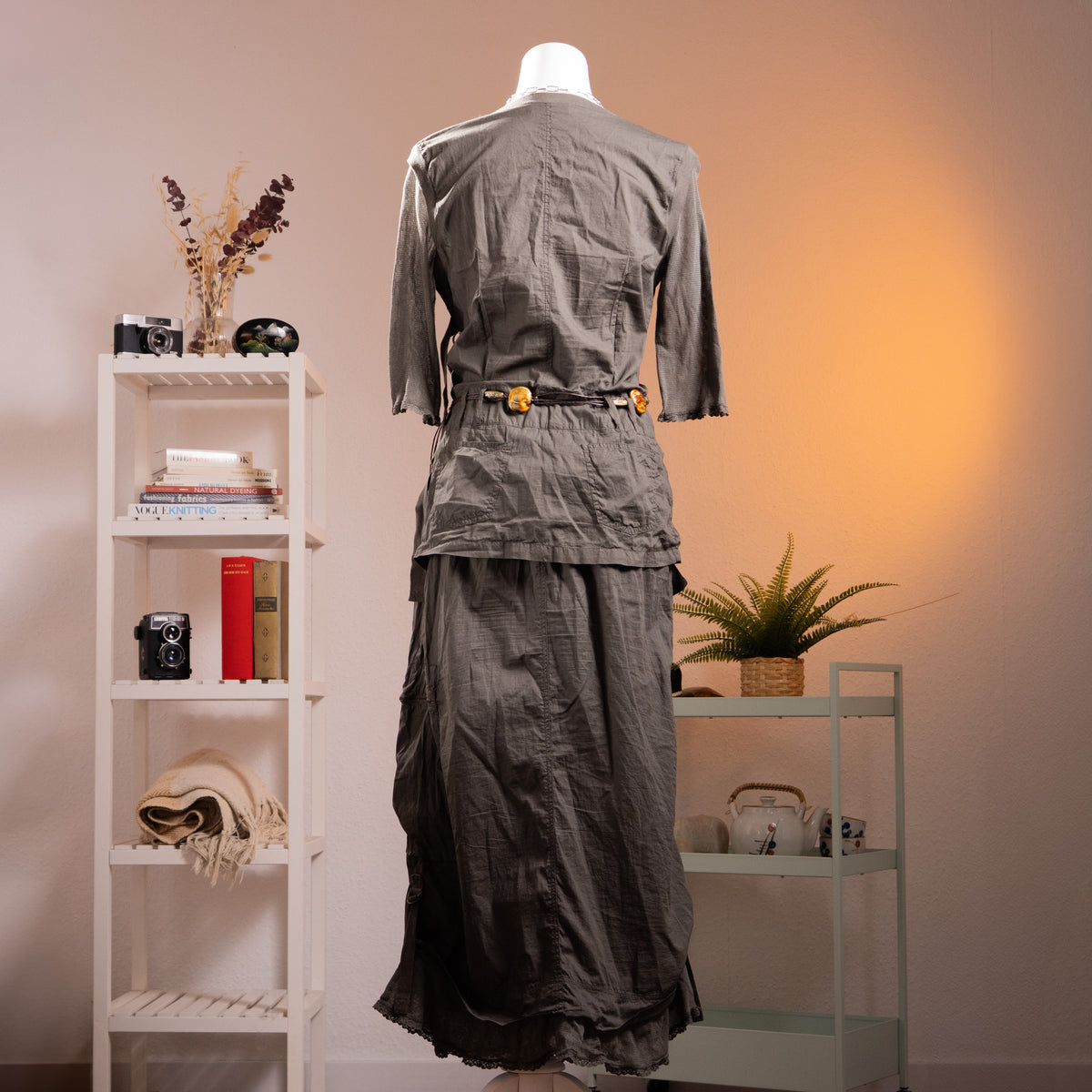 back view Archive Cop Copine "Pontivy" 90s French Avant-Garde Utility Gown – gunmetal grey cotton taffeta maxi dress with asymmetric square neckline, three-quarter sleeves with button detail, trompe l'oeil layered cargo pocket skirt with drawstring ruching, original amber resin belt, ruffled hem, product shot on dress form