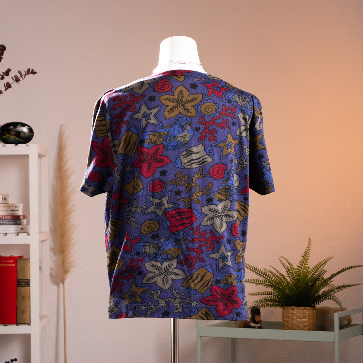 Back view of authentic 1980s Gucci marine life all-over print unisex t-shirt showcasing the continuous fish and coral pattern across the shoulders and back.
