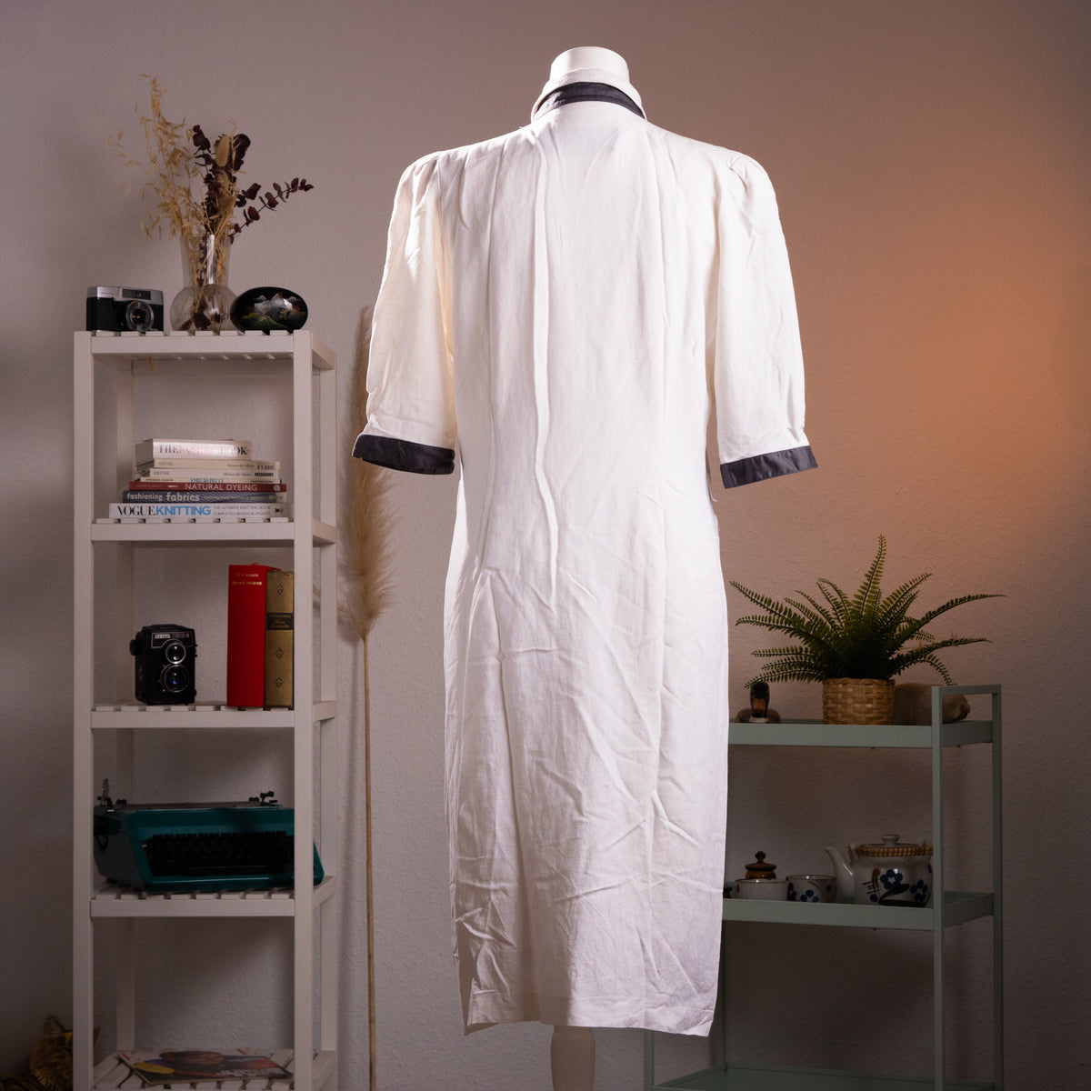 Rear view of the historical Louis Féraud linen-cotton blend tailored dress, showcasing the structured mid-length columnar silhouette and high-end tailoring.
