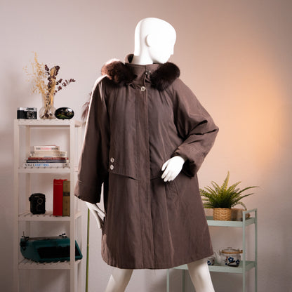 Front view of the archival Fourrures Jean-Louis Scherrer brown hooded coat with genuine fox fur trim from the 1990s on a mannequin