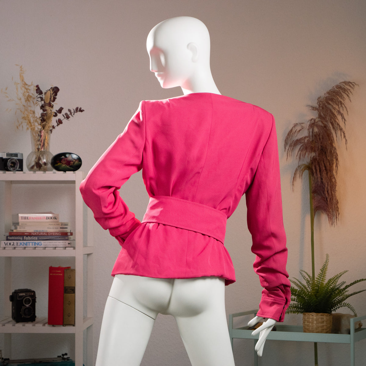 Rear view of the archival Tom Ford for YSL pink jacket showing the clean back tailoring and the wide matching waist belt.