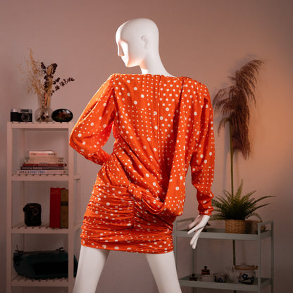 Rear view of the archival Emanuel Ungaro dress showing the deep draped peplum volume, strong padded shoulders, and tightly ruched skirt profile.
