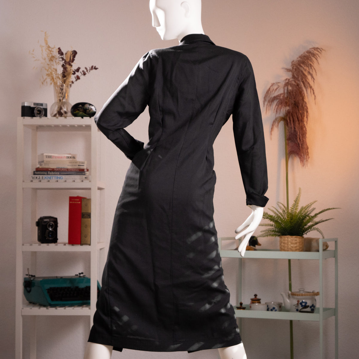 Rear view of the archival Oliver by Valentino maxi dress highlighting the tailored hourglass silhouette and strong shoulder pad profile.