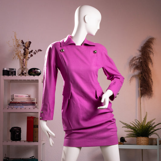 Front full-length view of the archival Courrèges Paris orchid-pink lambswool-angora shift dress featuring iconic silver chrome ball buttons on a museum mannequin.