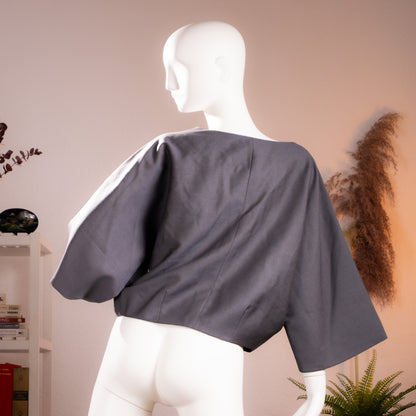 Rear view of the archival Chloé 2007 structural boxy cropped bolero jacket highlighting the wide geometric sleeve silhouette.