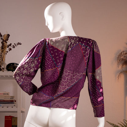 Rear view of the immaculate archival Emanuel Ungaro late 1980s purple silk damask blouse showcasing the seamless geometric patchwork print flow.