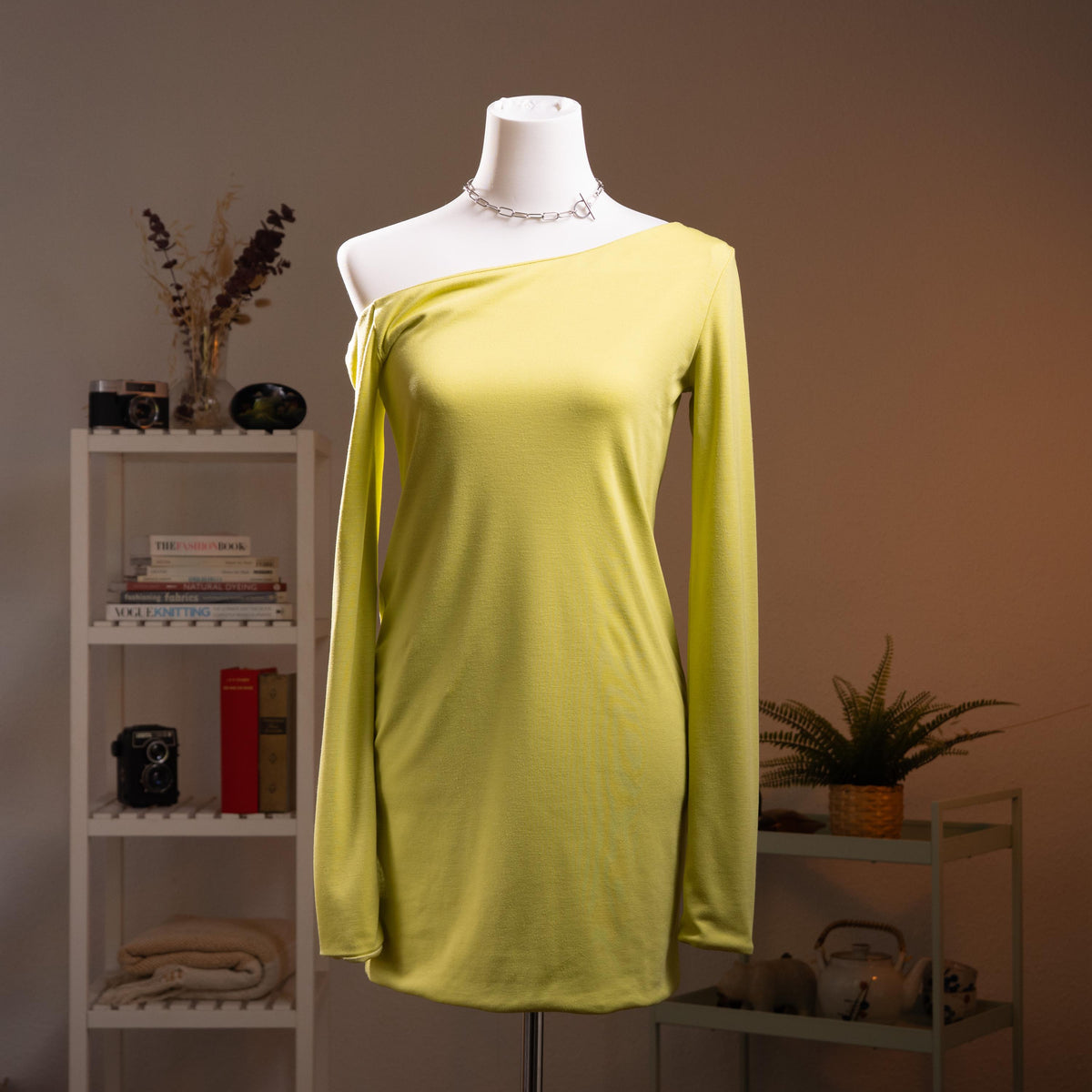 Archival Halston Mainline 2000s Acid Lime Asymmetric Off-Shoulder Mini Dress – saturated acid lime yellow-green stretch satin, single asymmetric diagonal off-shoulder neckline, one long sleeve, body-con mini silhouette, silk lining, Bradley Bayou era, Made in Italy IT 38 XS S, product shot on dress form